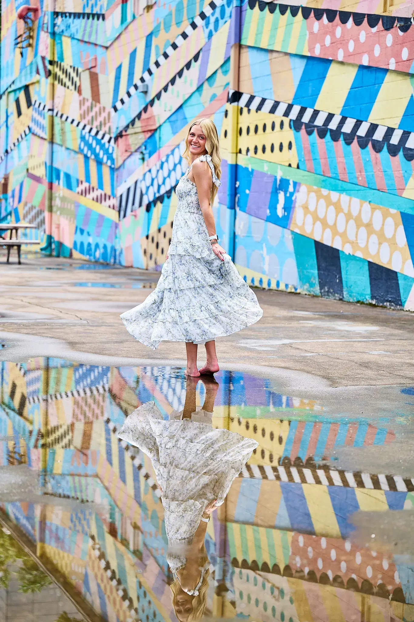 Professional Nashville mural portrait with colorful geometric wall and reflection